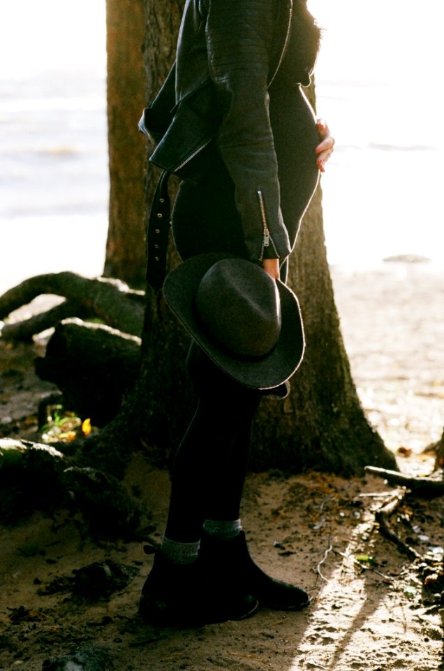 Photo Of Pregnant Woman Standing Behind The Tree