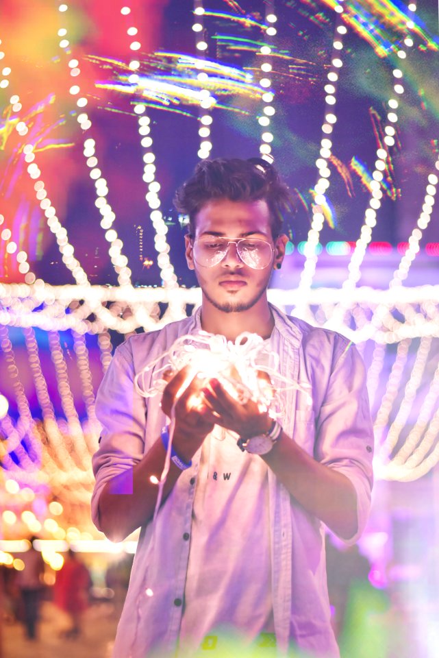 Man Holding String Light During Nighttime photo