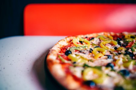 Closeup Photography Of Pizza On White Surface photo