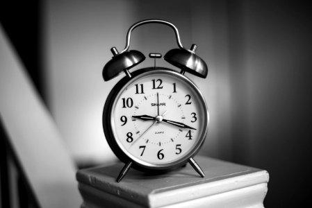 Grayscale Photo Of Twin Bell Alarm Clock photo