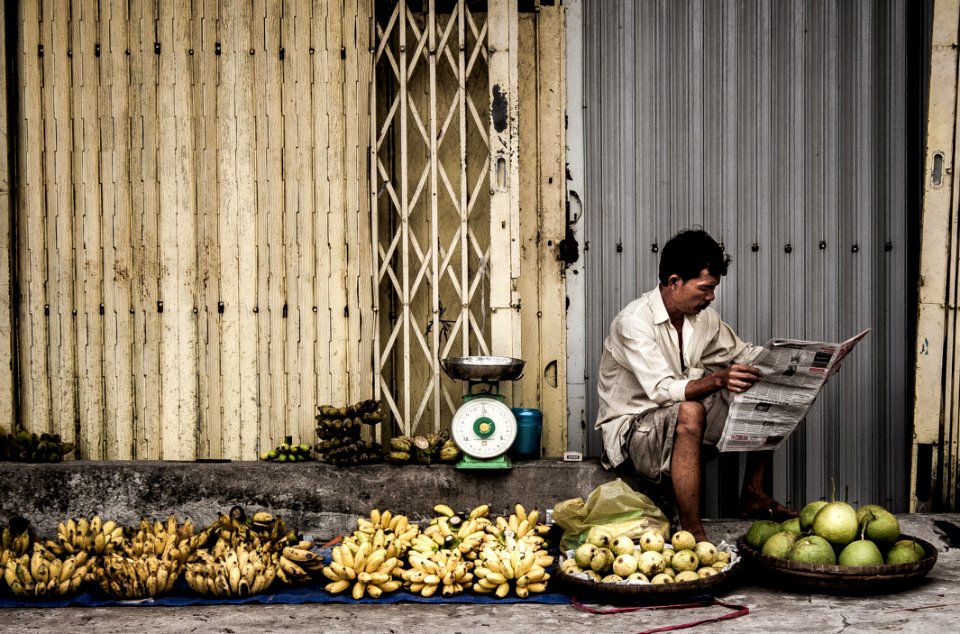 Man Sitting Near Fruits