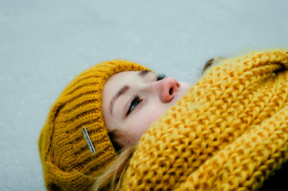 Woman Wearing Yellow Crochet Cap And Scarf photo