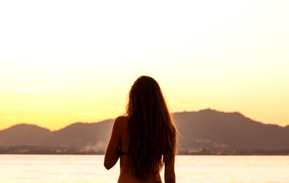 Woman Standing In Front Of The Sea