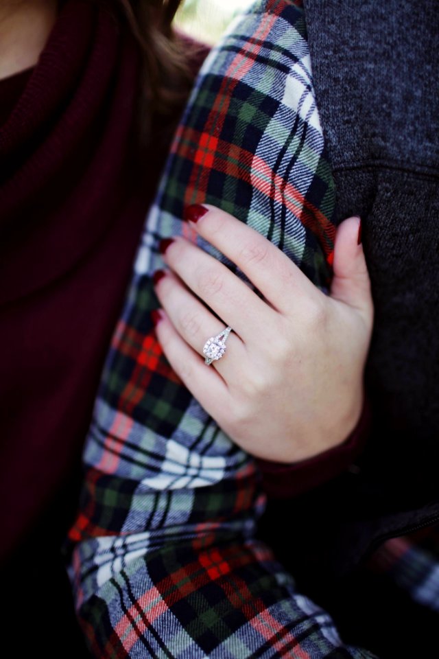 Woman Wearing Silver-colored Solitaire Ring Holding Persons Arm