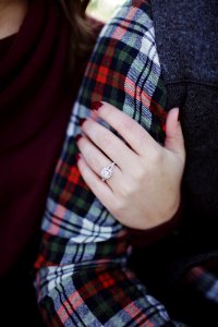 Woman Wearing Silver-colored Solitaire Ring Holding Persons Arm