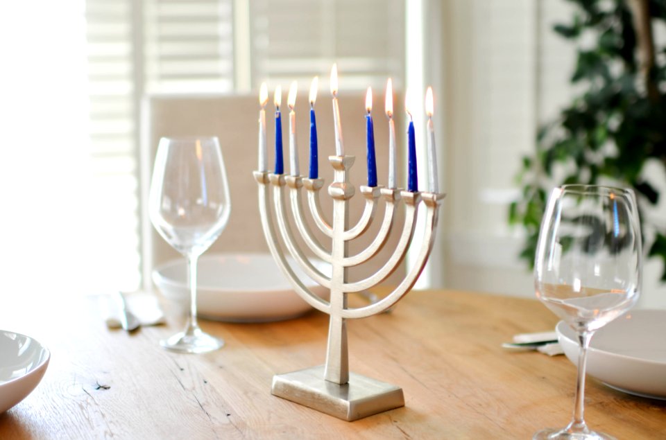 Stainless Steel Candelabra Beside Clear Wine Glasses