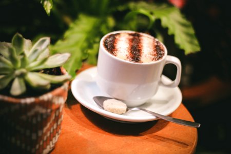 White Ceramic Mug With Stainless Steel Spoon photo