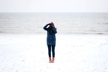 Woman Taking Picture On The Beach View