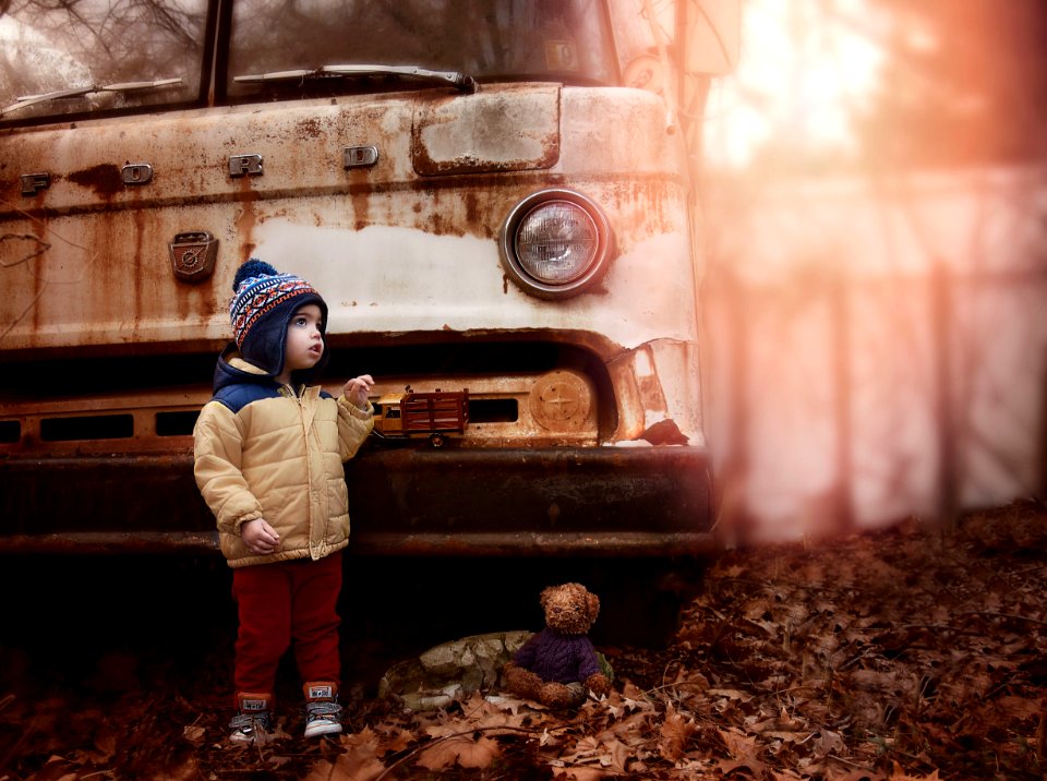 Toddler Wearing Brown Bubble Zip-up Jacket photo