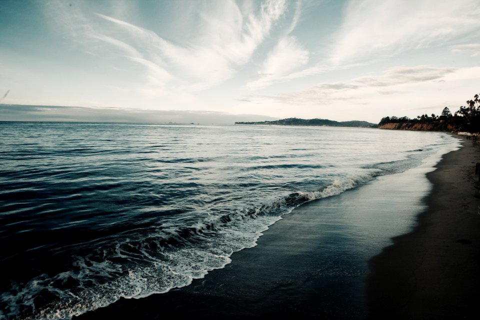 Shoreline Under Blue Sky