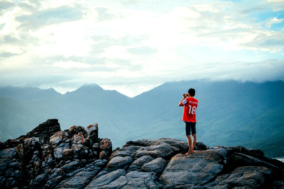 Man Having A Picture On Rock photo