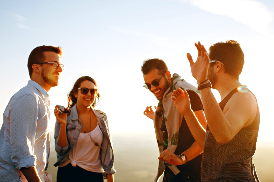 Group Of People Having Fun Together Under The Sun