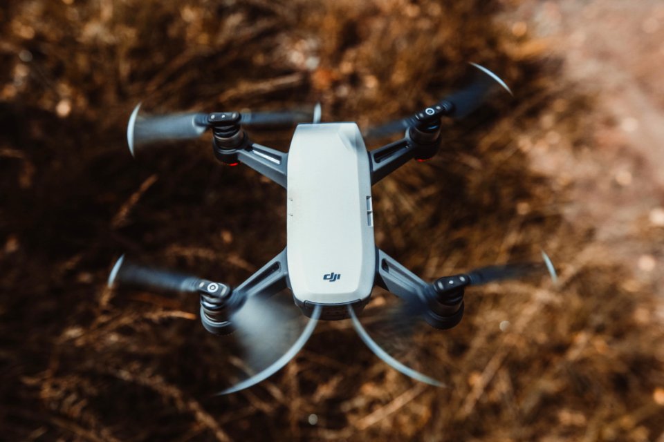 Selective Focus Photography Of White And Black Quad Copter