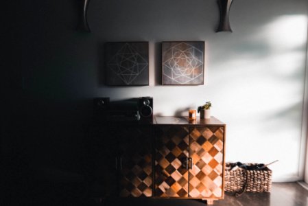 Black Audio Speaker On Brown Wooden Cabinet