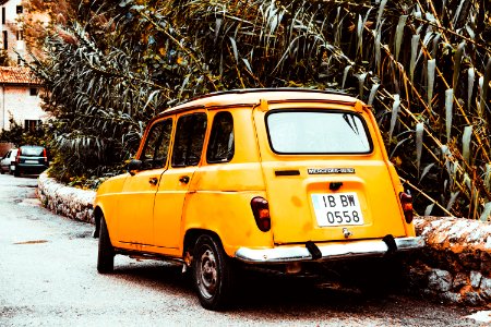 Classic Yellow Car On Side Of Road At Day photo