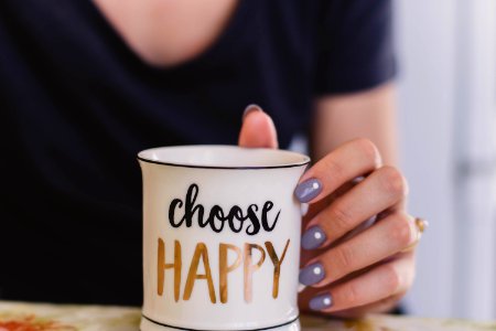 Selective Focus Photography Of Person Touch The White Ceramic Mug With Choose Happy Graphic photo