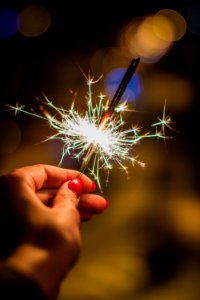 Person Holding Gray Firework photo