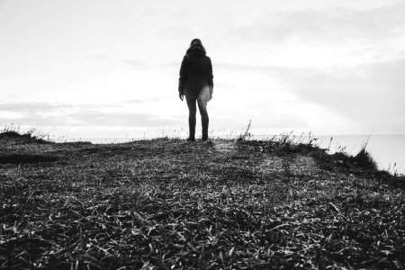 Grayscale Photo Of Person In Parka Coat photo