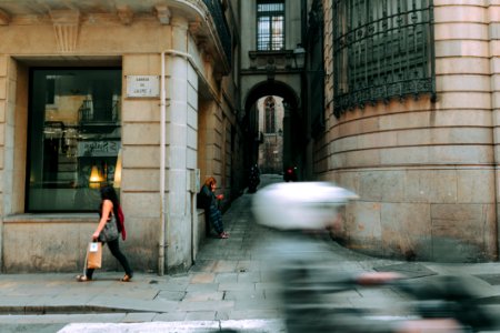 Woman In Black Walking Near Glass Window