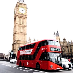 Red Bus On Road Near Big Ben In London photo