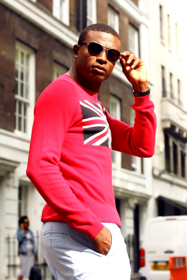Man In Red And White Clothes Standing Near Street