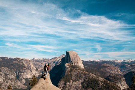 Woman With Baby At The Peak Of A Mountain
