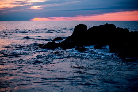 Rocky Sea Shore During Sun Set photo