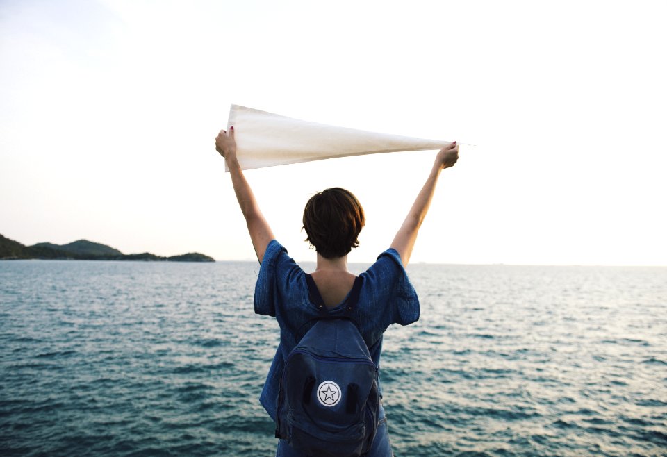 Person In Blue Short Sleeved Shirt Holding White Cloth