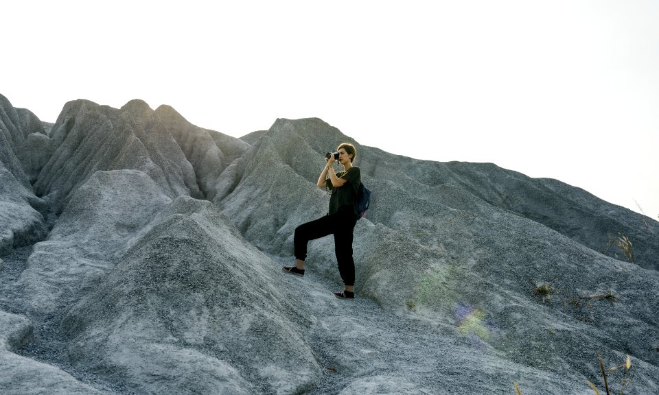 Woman Standing In Front Of Mountain