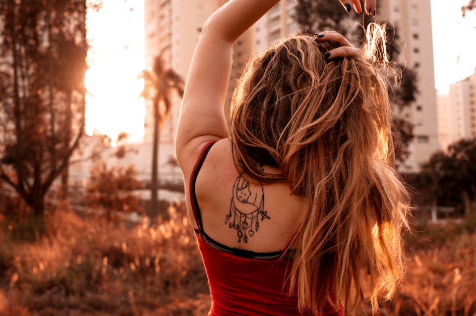 Woman Wearing Red Spaghetti Strap Top