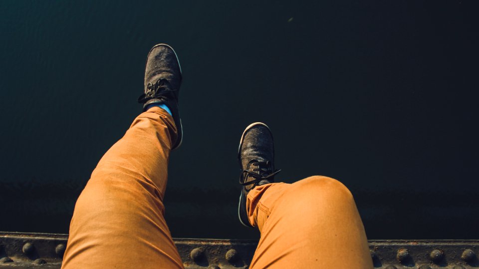 Person Wearing Brown Jeans With Pair Of Black Sneakers photo