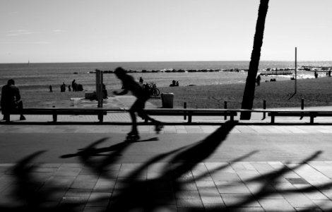 Person Skating On Road In Grayscale Photography photo