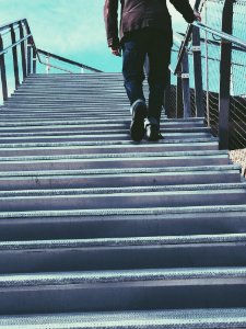 Man Walking On Gray Stairs