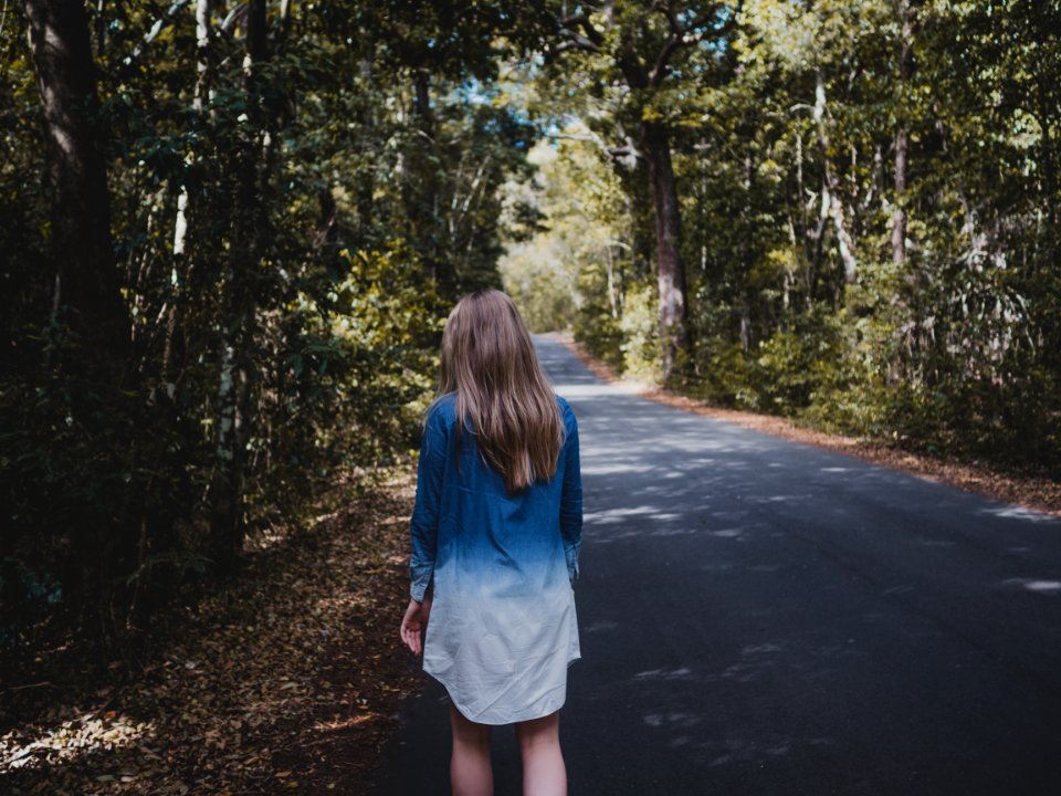 Woman Wearing Blue And White Long-sleeved Shirt Walking Near Tree