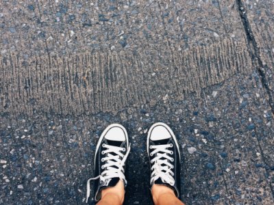 Person Wearing Pair Of Black-and-white Converse All Star Low Sneakers photo