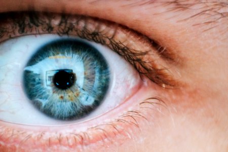 Person With Teal And Yellow Left Eye