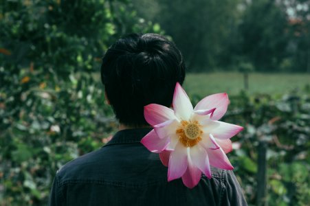 Pink Flowers On The Shoulder Of Person