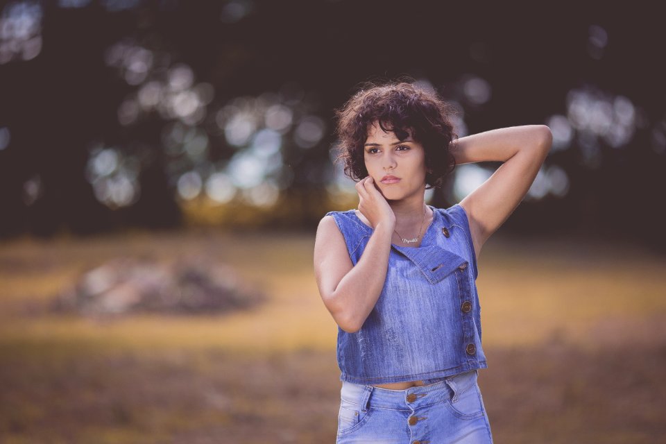 Woman Standing On Field Selective Focus Photography
