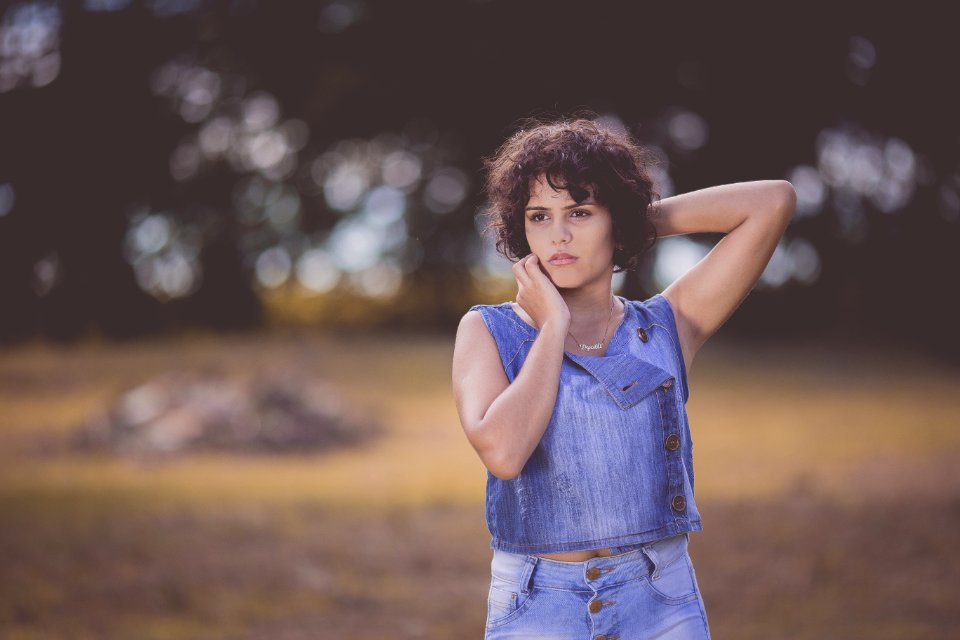 Woman Standing On Field Selective Focus Photography photo