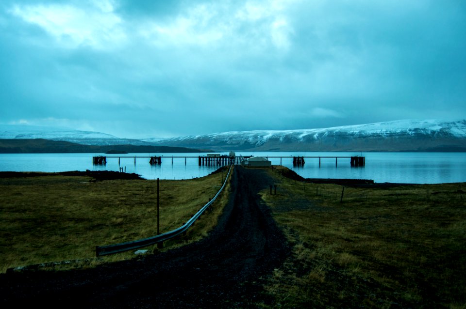 Brown Dock Near Snow Mountain At Daytime