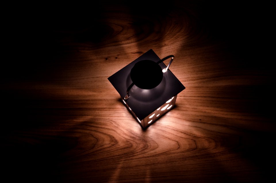 Gray Steel Candle Lantern On Brown Wooden Board