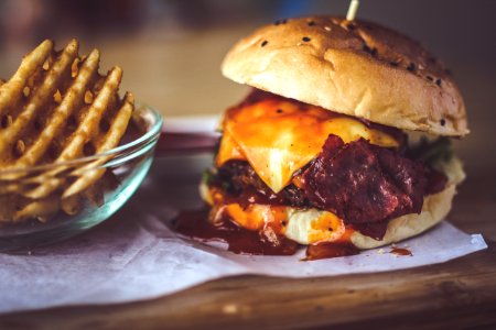 Closeup Photography Of Bun With Cheese Patty Egg And Bacon photo