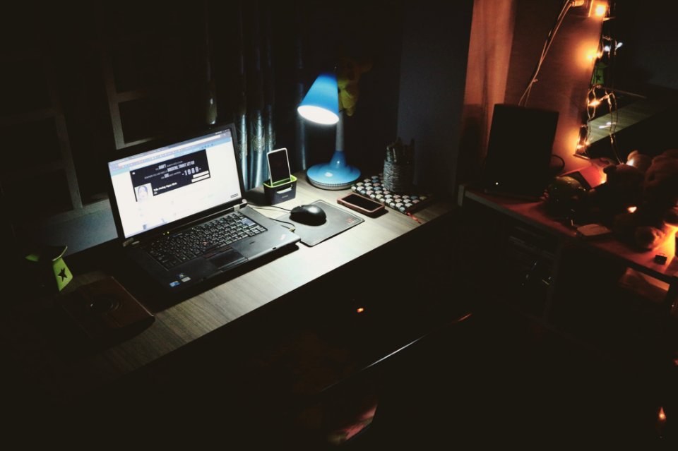 Black Laptop Beside Black Computer Mouse Inside Room photo