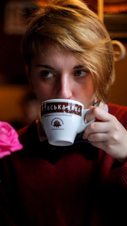 Woman Wearing Red Top Holding Teacup