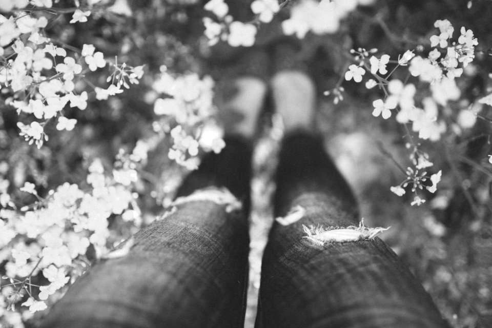 Girl Standing In Yellow Flowers