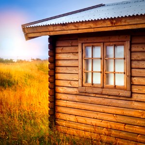 Brown Wooden Cottage At The Field During Day photo