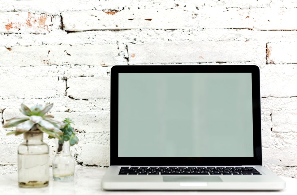 Macbook Pro On White Surface