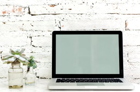 Macbook Pro On White Surface