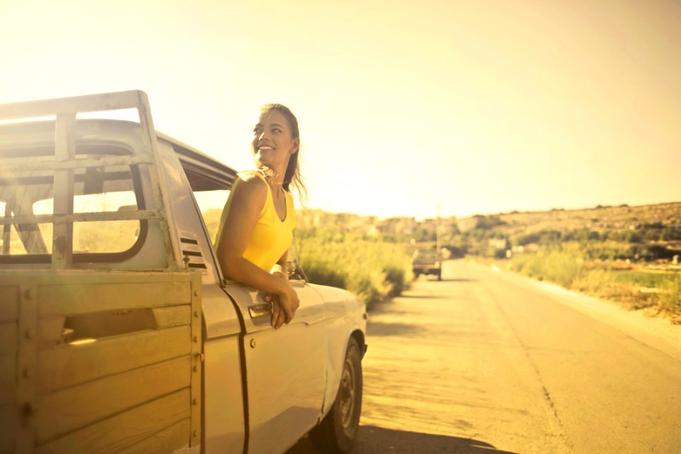 Woman Wearing Yellow Shirt Inside Pickup Truck