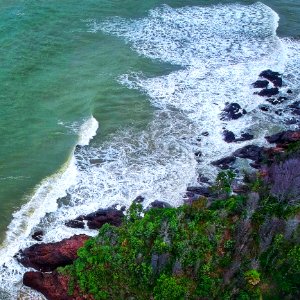 Aerial Photography Of Seashore Beside Islet photo